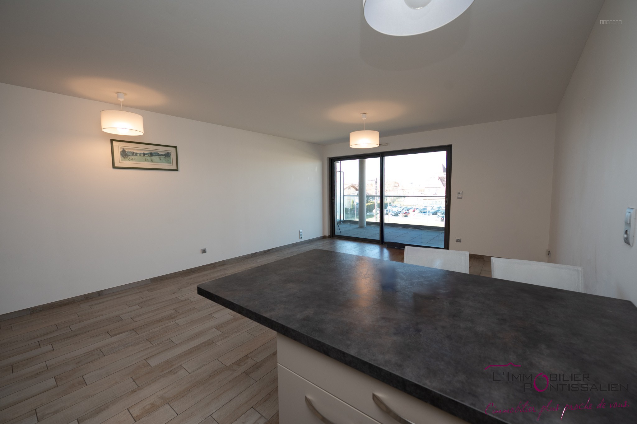 PONTARLIER - PROCHE CENTRE VILLE : APPARTEMENT RECENT DE TYPE 2 AVEC ASCENSEUR, CAVE, GARAGE ET TERRASSE — photo 7